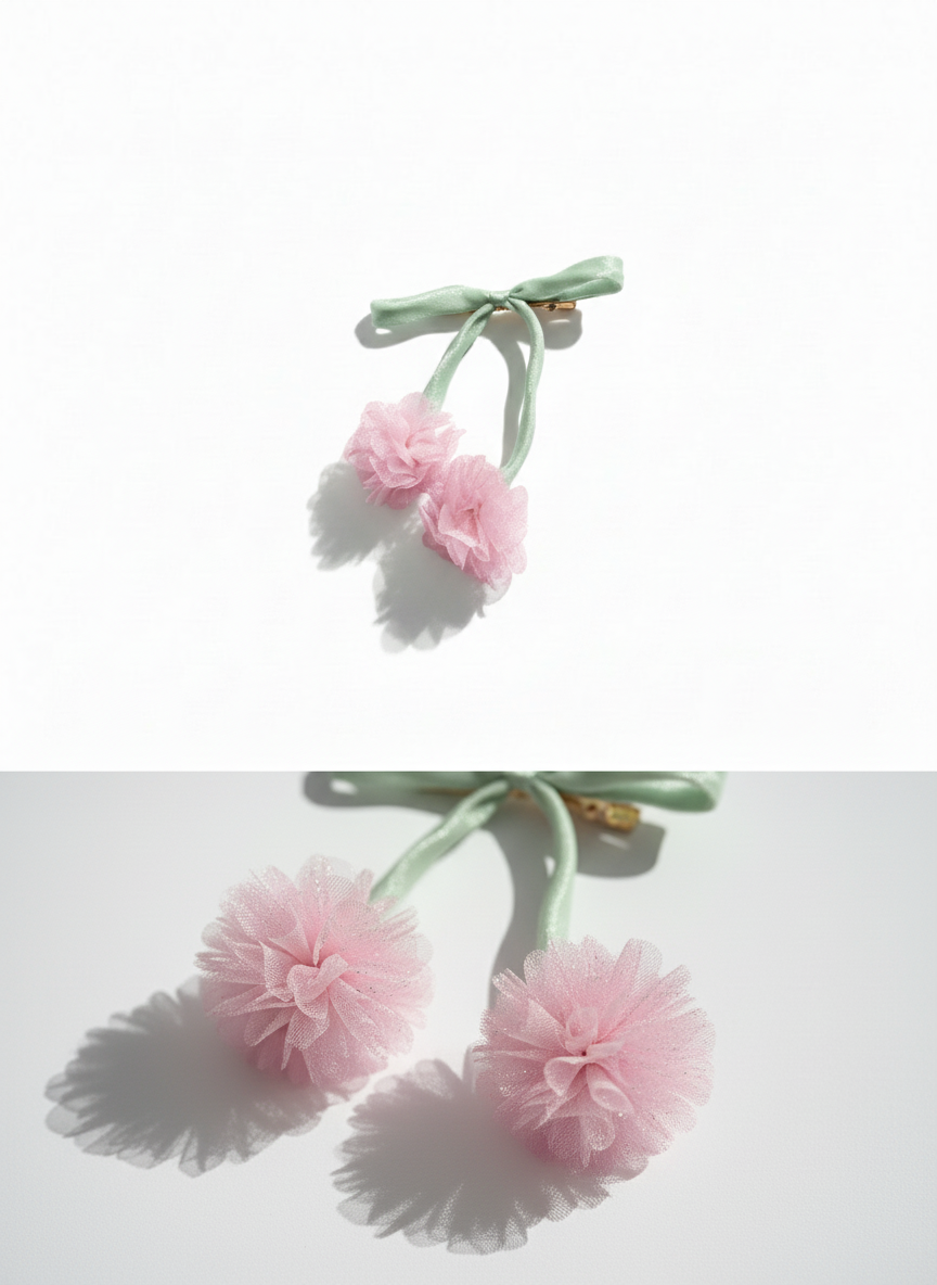 Pink floral hair clip on a white background